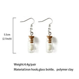 Lianfudai Ghost in Bottle Earrings Glow in the Dark Ghost Dangle Earrings Luminous Halloween Jewelry for Women and Girl