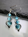 Lianfudai 2024 New Bohemian Wave Inlaid Cat's Eye Gem Swing Earrings