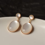 Lianfudai Christmas gifts ideas Korea New White Moonlight Cat's Eye Stone Earrings For Women Small Fresh Geometric Eardrop Elegant Ladies Temperament Jewelry